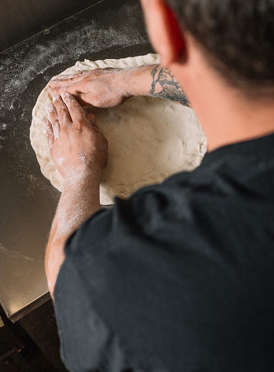 preparing dough for pizza